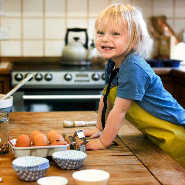 Kid cooking class baking concept