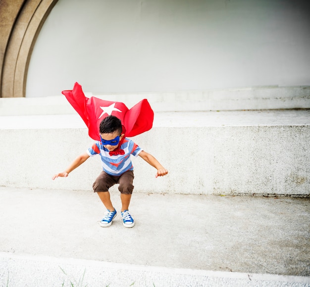 Kid dressup superhero fly concept