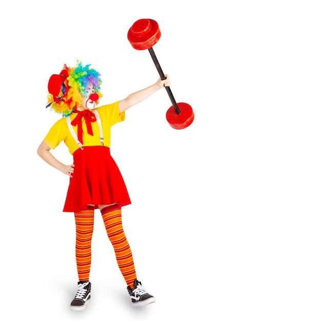 Foto kinder in bunten clown-outfits auf weißem hintergrund