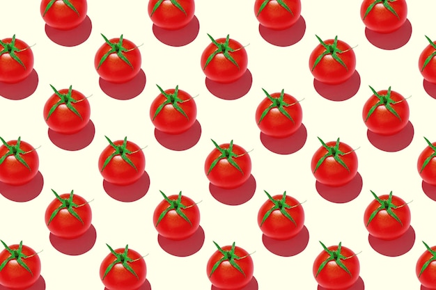 Kirschtomaten-Muster auf farbigem Hintergrund Muster einer Tomaten-Draufsicht