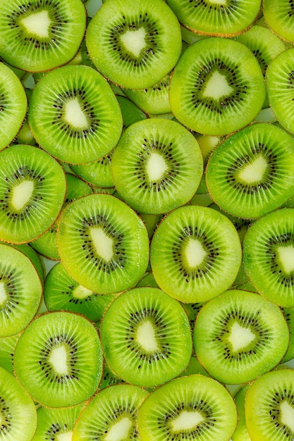 Kiwi MacroFresh Kiwi in Scheiben geschnitten für den Hintergrundschöner Kiwi-Scheiben-Hintergrund