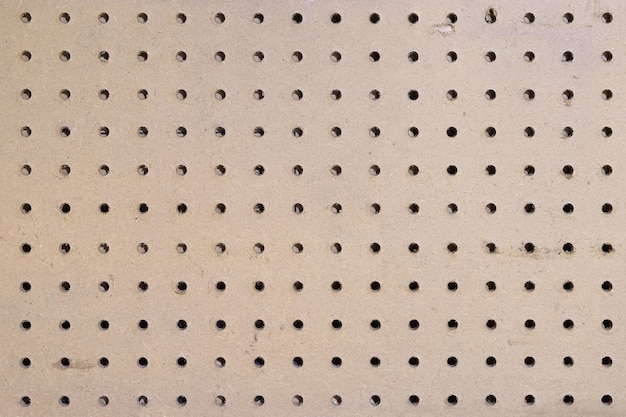 Foto klassischer brauner pegboard-hintergrund