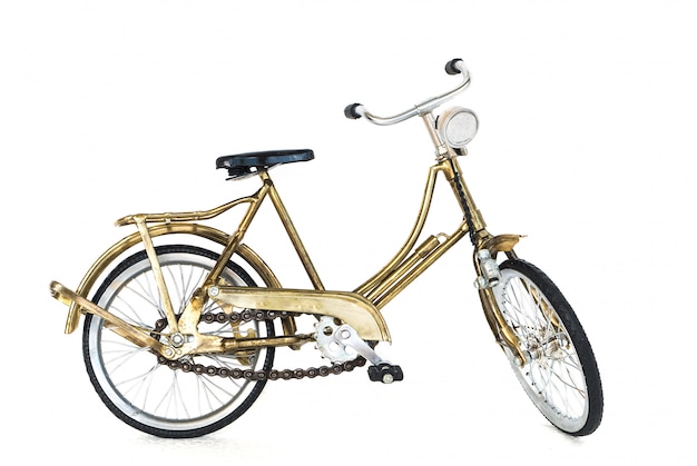 Kleines goldenes Spielzeugfahrrad