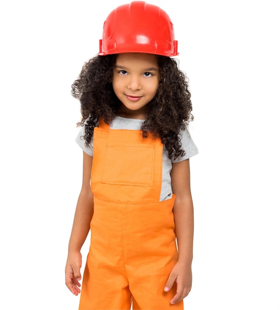 Kleines Mädchen in orangefarbener Handwerkeruniform isoliert