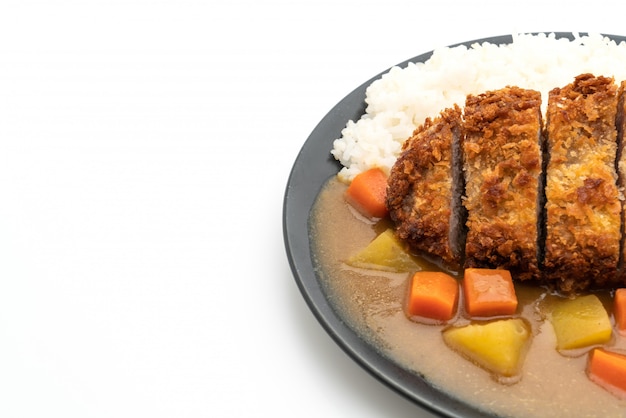 Knusprig gebratenes Schweinekotelett mit Curry und Reis