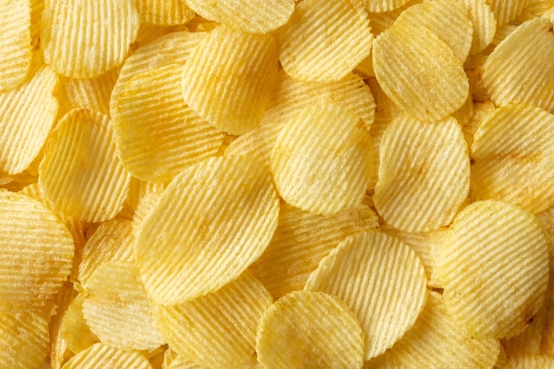 Knusprige goldene Kartoffelchips Snack Textur Hintergrund