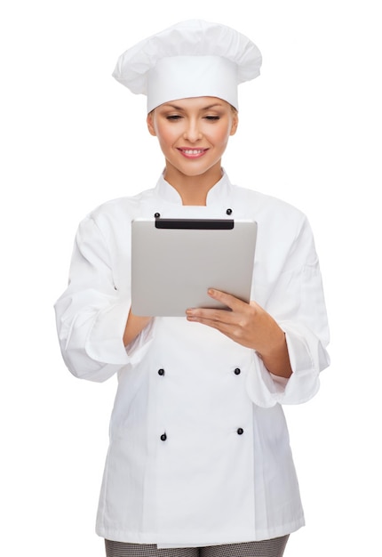 Koch-, Technologie- und Lebensmittelkonzept - lächelnde Köchin, Köchin oder Bäckerin mit Tablet-PC-Computer