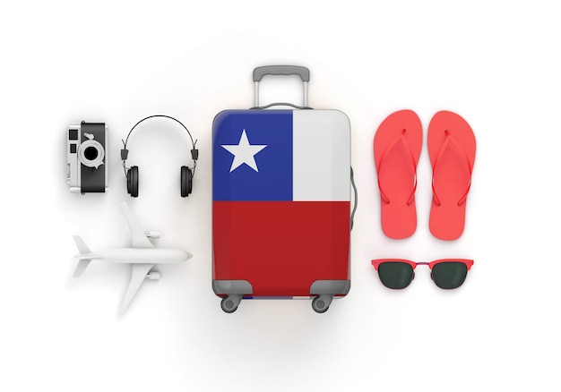 Koffer und Reisezubehör mit chilenischer Flagge liegen flach d