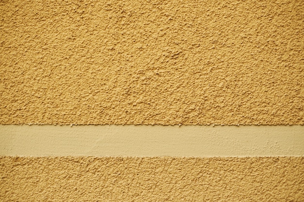 Konkrete orange lackierte robuste, vergipste Wand