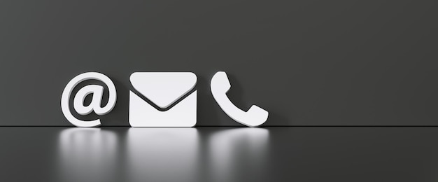 Foto kontaktmethoden nahaufnahme eines telefon-e-mail- und post-symbols, das sich an eine schwarze wand lehnt