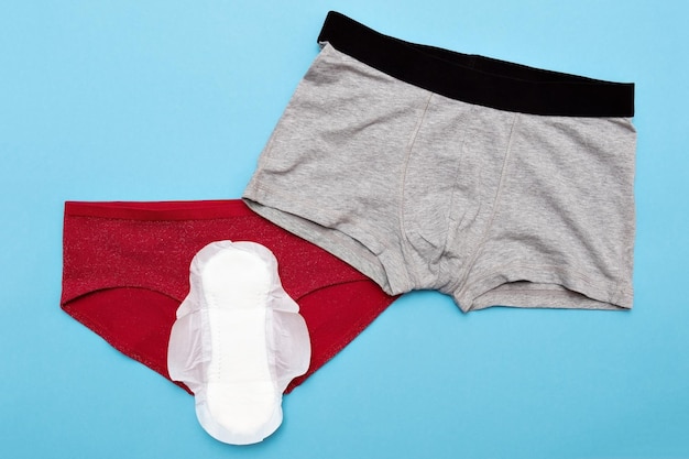 Foto konzept der menstruation männliche und weibliche unterwäsche mit polster