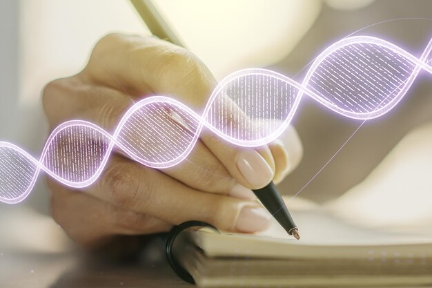 Foto kreative licht-dna-illustration und frauenhandschrift im tagebuch über hintergrundwissenschaft und biologiekonzept mehrfachbelichtung