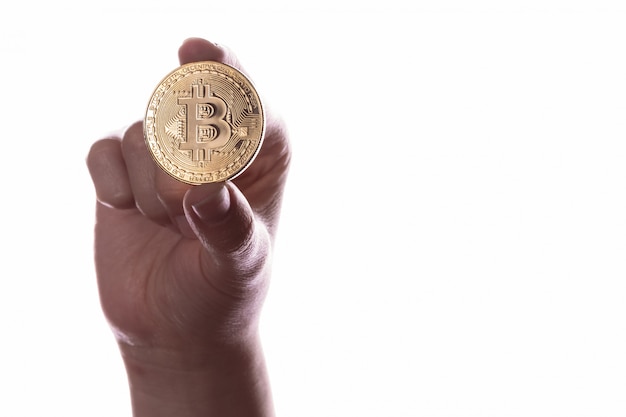 Kryptowährungsmünze bitcoin in der Hand