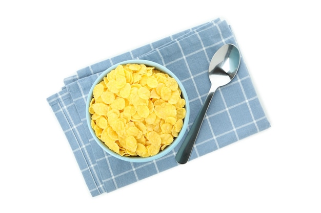 Küchentuch mit Schüssel Cornflakes und Gabel isoliert auf weiß