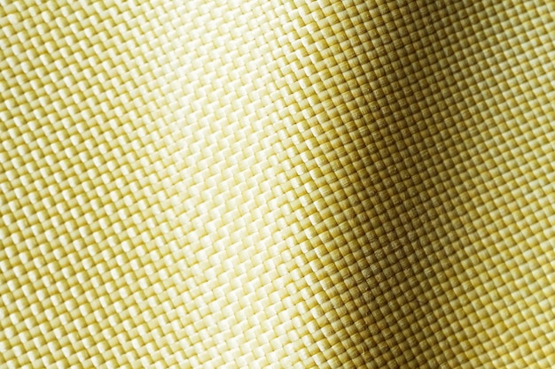 Kugelsicheres Material Aramid Aramid-Kevlar-Hintergrund Goldene Kevlar-Textur und -Muster