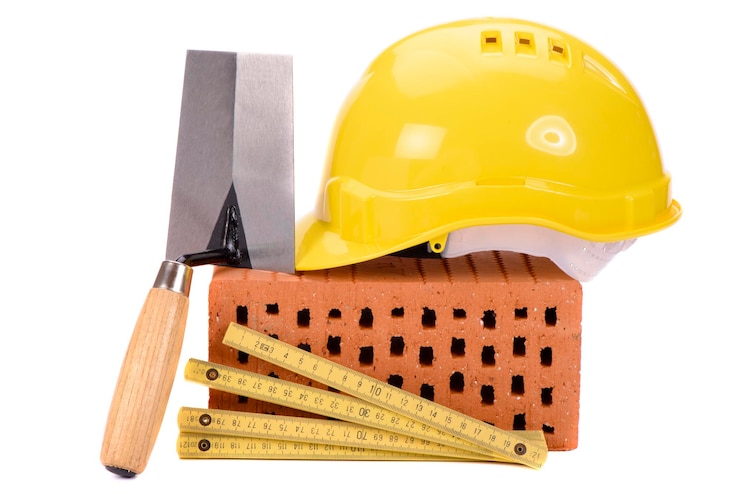 Foto ladrillos y herramientas para la construcción de casas