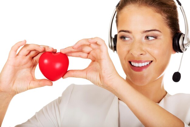 Foto lächelnde geschäftsfrau hält einen stressball vor weißem hintergrund