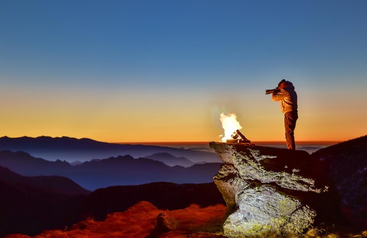 Foto landschaftsansicht eines mannes, der eine landschaft fotografiert