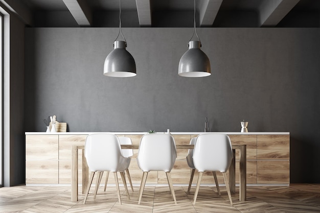 Langer Esstisch aus Holz mit weißen Stühlen in einer dunkelgrauen Küche. 3D-Rendering-Attrappe