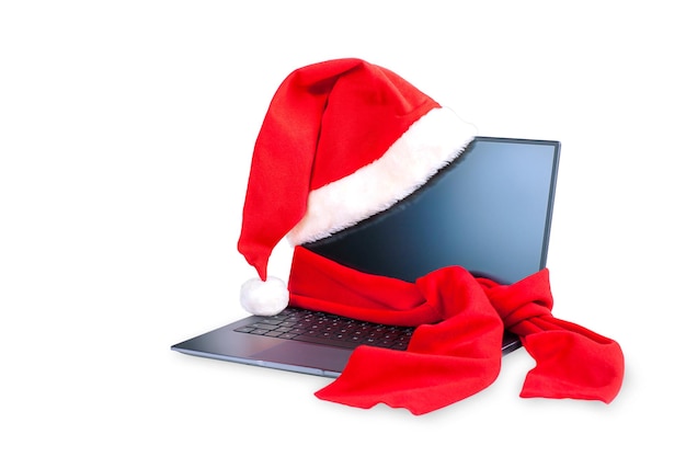 Laptop de natal com chapéu de papai noel e cachecol