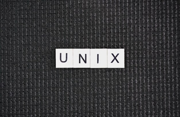 Laptop keyboard with the word UNIX Unix is a family of multitasking multiuser computer operating sys
