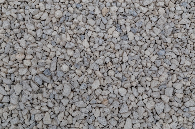 Lastre de piedra caliza blanca seca fondo de fotograma completo plano Textura de piedras de macadán rotas polvorientas grises pequeñas