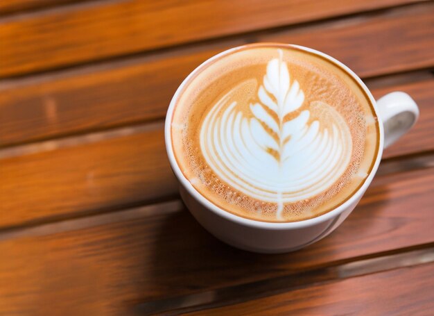 Latte-Kaffeetasse auf Holztisch Internationaler Kaffeetag