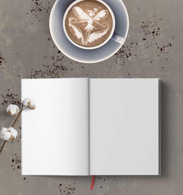 Foto lattekunst einer fee und ein leeres offenes buch auf grau