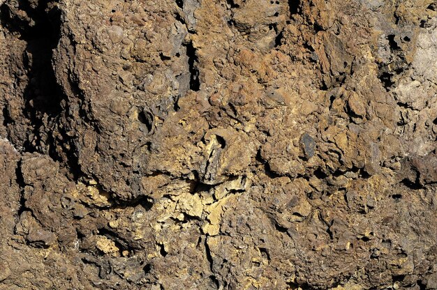 Lava endurecida da textura de pedra nas Ilhas Canárias Vulcânicas de Tenerife