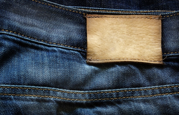 Leder Jean Blue Denim-Jeans mit Etikett als Hintergrund verwendet