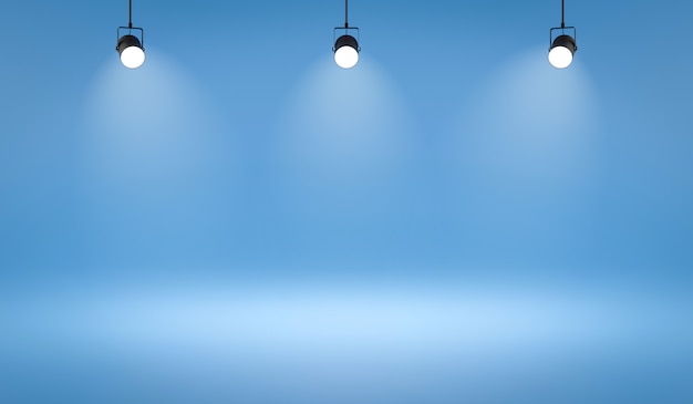 Leere Fotostudio-Hintergründe und Scheinwerfer auf blauem Raumhintergrund mit zeigender Szene.