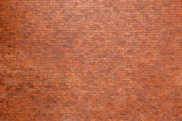 Leere orange Backsteinmauer