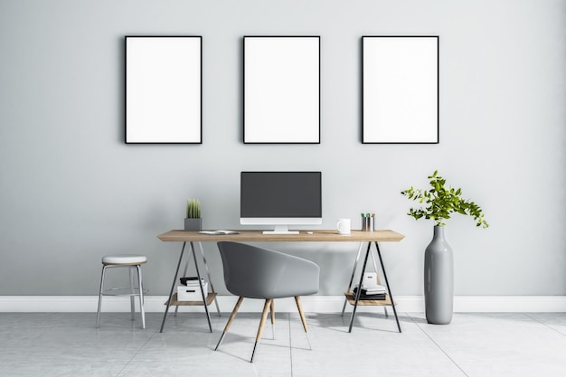 Leere weiße Poster in schwarzem Bilderrahmen an heller Wand über stilvollem Arbeitsplatz zu Hause mit Monitor auf Holztisch, grauer Stuhl und Vase auf Marmorboden 3D-Rendering-Attrappe