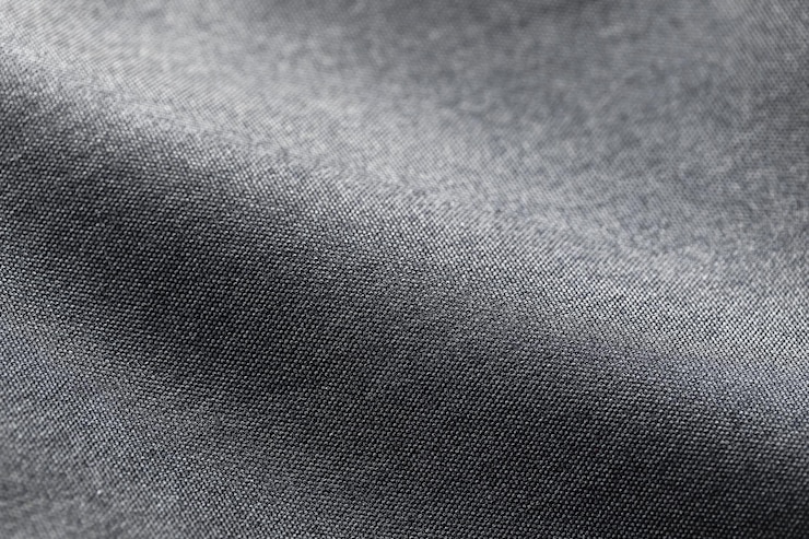 Foto leinwand polyesterstruktur synthetisch für den hintergrund schwarzer textilhintergrund aus polyestergewebe für die kunstgestaltung im innenbereich oder textnachricht hinzufügen