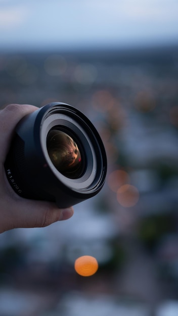 Lente fotográfica com reflexo do pôr do sol