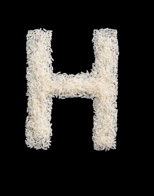 Letra del alfabeto de grano de arroz blanco
