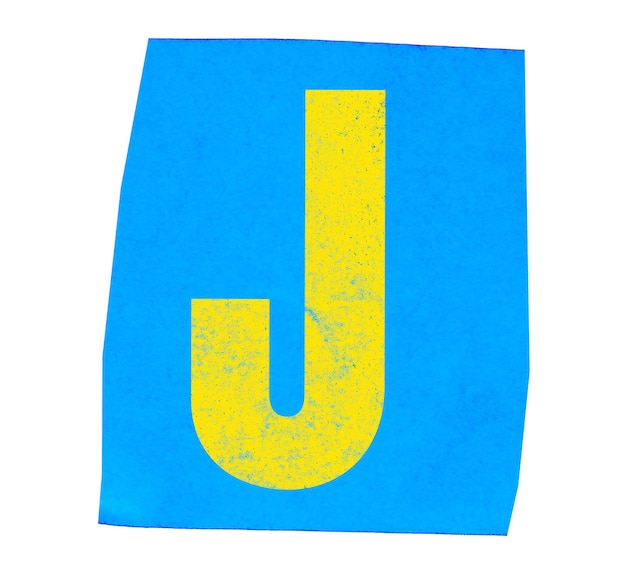 La letra amarilla "j" en el papel azul