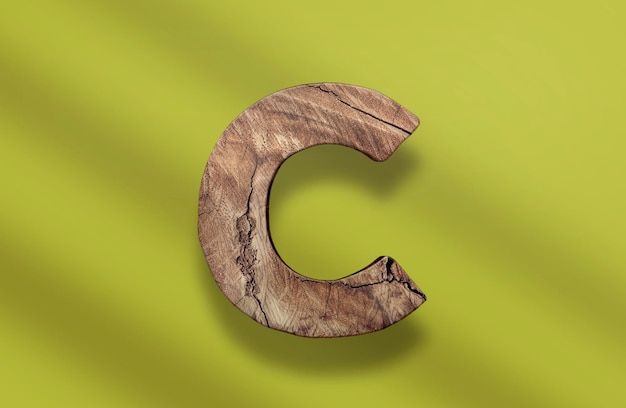 Una letra c de madera PSD con un fondo verde