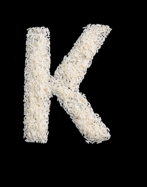 Letra do alfabeto de grão de arroz branco