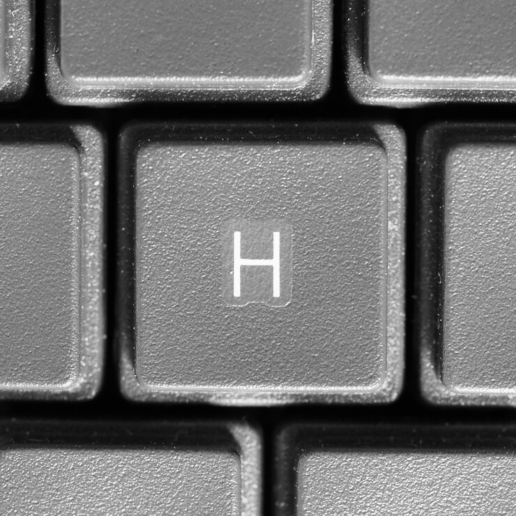 Foto letra h en el teclado de la computadora