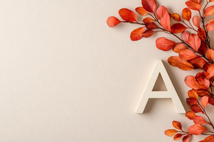 Letra A de otoño con hojas rojas