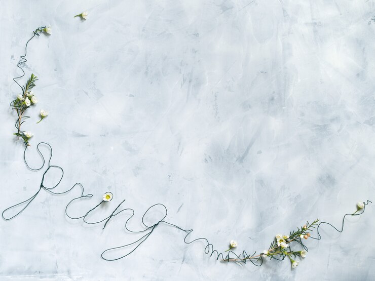 Letras de primavera com flores brancas em fundo cinza