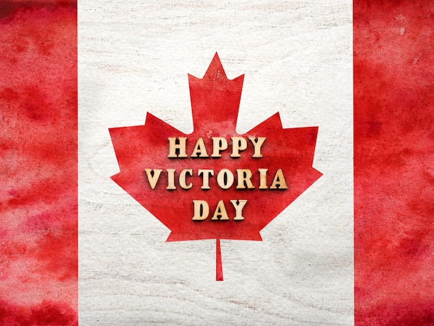 Letras do Victoria Day no fundo da bandeira canadense