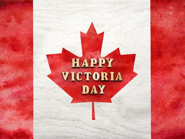 Letras do victoria day no fundo da bandeira canadense