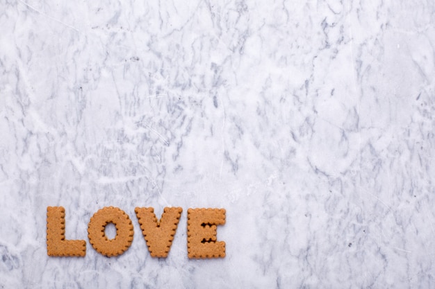 Letras sabrosas galletas Amor sobre mármol