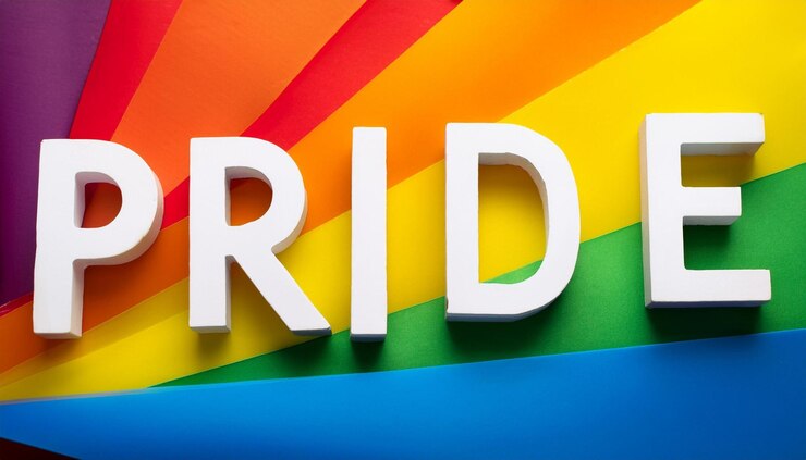 Foto un letrero de color arco iris que dice verdu en él