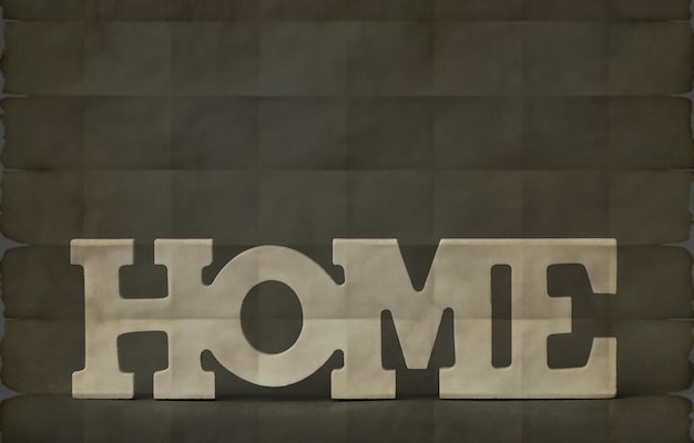 Un letrero gris que dice que el hogar está sobre un fondo negro.