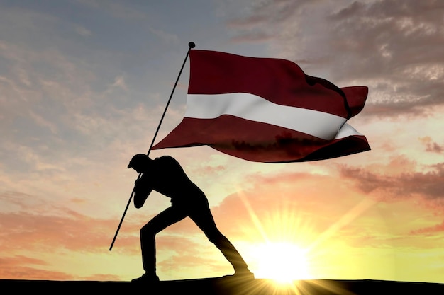 Lettische Flagge wird von einer männlichen Silhouette 3D-Rendering in den Boden gedrückt