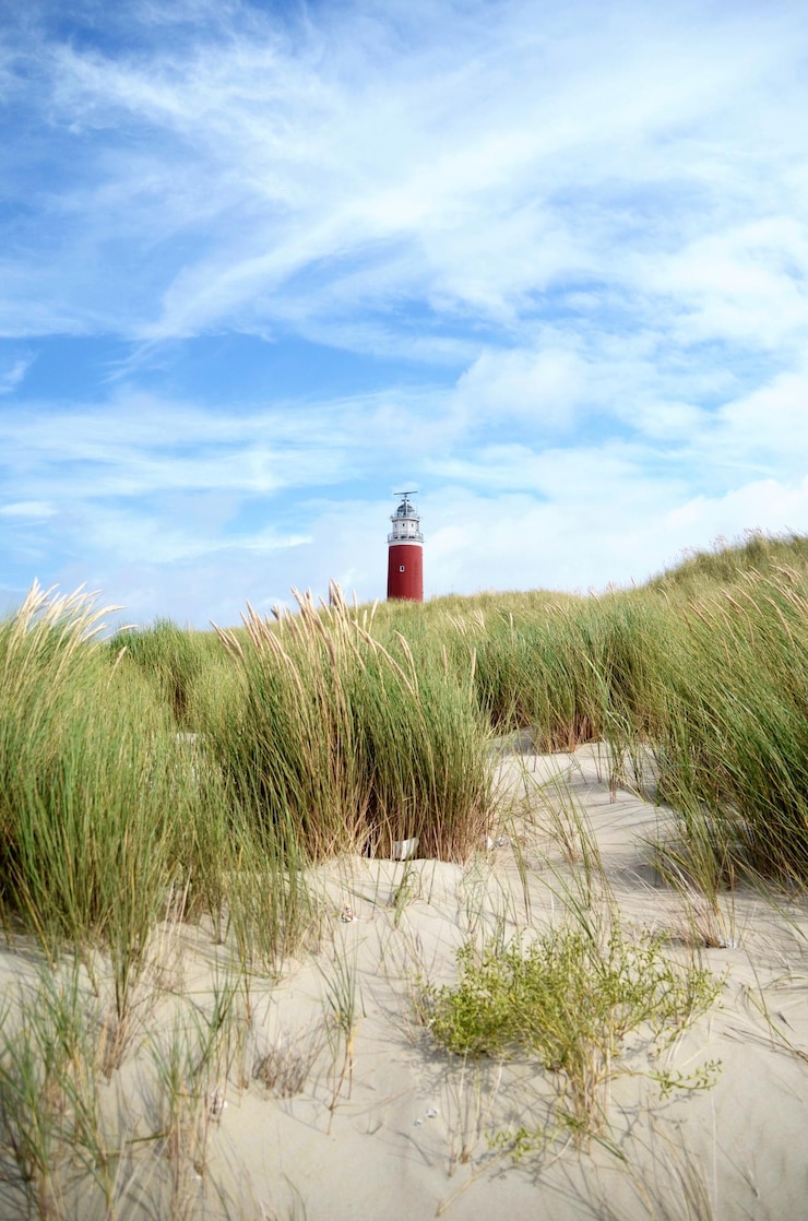 Foto leuchtturm am strand gegen den himmel