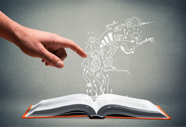 Libro abierto con dibujo de fondo